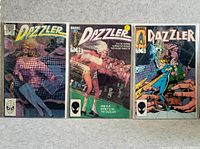 Three individual Marvel Dazzler comics laid out side by side showing front covers, issue numbers 27, 35, and 41.