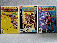 Photo showing three Warlord comic books together, front covers visible.
