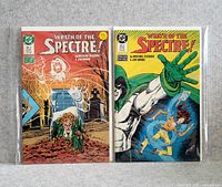 Photo of two Wrath of the Spectre comic books in protective sleeves, showing front covers.