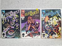 Three Elfquest comic books laid side-by-side, showing the front covers including detailed artwork and Marvel logo.
