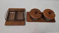 Top view of rectangular glass condiment set on teak tray