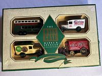 Front of the original box containing four die-cast metal vehicles from the Marks & Spencer Days Gone Collection, showing the vehicles and vintage branding.