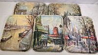 Photo of all five fiberglass trays laid out, showing artwork with famous Paris landmarks including Eiffel Tower, Moulin Rouge, Montmartre, Notre Dame, and Arc de Triomphe.