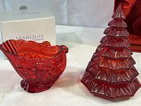 Red crystal candy dish in sleigh shape with Marquis box behind it.