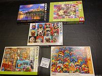 Lot overview showing all 5 puzzle boxes arranged on black background