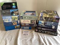 Full view of all 14 puzzle boxes stacked in three columns, showing various brands and images.