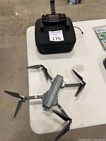 Tabletop view showing drone unfolded arms and attached propellers