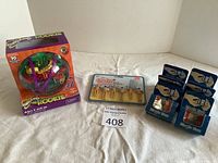 Photo showing the entire lot: Perplexus Rookie puzzle toy in its box on the left, a set of fun drink markers in packaging on the right, and six blue magic boxes in front.