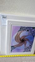 Abstract purple fractal spiral print with mat and protective covering, tape measure for scale