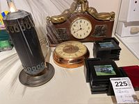 Full view of fiber optic lamp, two clocks, and two sets of coasters on table