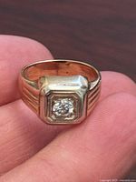 Front view of ring showing octagonal bezel and center diamond