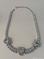 Full view of the vintage Sherman rhinestone necklace showing the full choker length design with oval and round rhinestones distinctively arranged.
