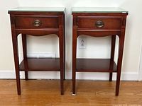 Front view of both wood bedside tables side by side