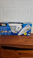 Photo of Black & Decker Dustbuster 12V vacuum in unopened retail box with front product image and branding