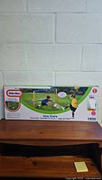 Full view of unopened box showing Little Tikes Easy Score soccer set with large goal, ball, and pump.