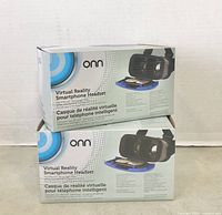 Two Onn virtual reality smartphone headsets in packaging stacked one on top the other