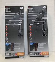 Photo showing two boxed GE Pro Outdoor Antennas, front of the packaging with product image, features, and specifications visible.