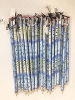 Photo showing 30 jumbo pencils with blue Backstreet Boys Millennium-themed designs, some pencils mint condition with tags attached.