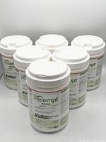 Six containers of PREempt disinfectant wipes arranged facing front showing product labels clearly.