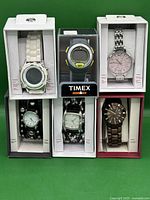 Full lot view showing all 6 watches in original packaging, with visible Timex Ironman digital model in the center