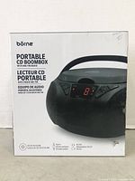 Photo of original product box showing Borne Portable CD Boombox with AM/FM radio, listing features like CD/CD-R/CD-RW playback, auxiliary input, and AC/DC power.