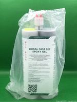 Photo shows one sealed container of Dural Fast Set Epoxy Gel adhesive in plastic packaging, against a green background.