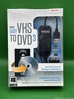 Front of sealed Roxio Easy VHS to DVD 3 retail box showing product image with USB capture device and software disc icon.