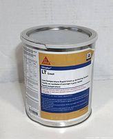 Photo of one sealed metal can of Sikadur LT Low-Temperature Rapid Grout with a yellow and blue label.