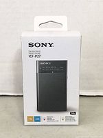 Sony ICF-P27 portable AM/FM radio in original factory box showing front panel and product features