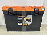 Front view of the TOOLWAY 19 inch jumbo professional toolbox showing the black bottom and orange top with latch locks and a label on the front.