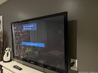 Samsung 44 inch flat screen television powered on showing 'No Time Information' and 'Check signal cable' message on HDMI2 input.