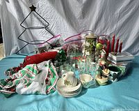 Photo showing all vintage Christmas items including figurines, glassware, ornaments, candles, textiles, and metal tree frame