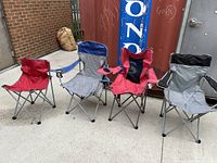 Four camping chairs arranged in a row showing colors and condition.