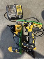 Overall view of the DeWalt cordless drill with attached belt clip and charger cord
