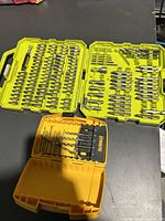 Open Ryobi drill bit case showing many assorted drill bits in molded organizer