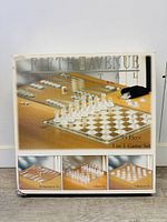 Box front and side showing the Fifth Avenue Crystal 3-in-1 Game Set containing chess, checkers, and backgammon with frosted glass pieces.
