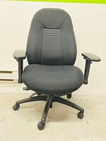 Front view of the black Global ObusForme office chair showing seat, backrest, and armrests with a five-wheel base.