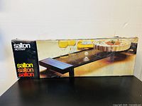 Original box packaging showing the Salton Hottray warming tray and food on top.