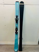 Front view of left ski showing topsheet graphics and binding