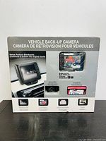 Front view of the Winplus vehicle back-up camera box showing the product image, features in English and French, and the 3.5 inch color LCD screen with various display examples.