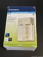 Top view of unopened product box showing Westinghouse branding, model 63490, LED 1 light brushed nickel fixture with bubble glass.