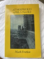 Yellow paperback book cover with title 'ATMOSPHERES APOLLINAIRE' by Mark Frutkin, showing a black and white photo of a gargoyle statue and cityscape.