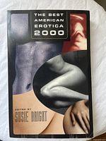 Front cover of 'The Best American Erotica 2000' book, showing artistic images of human forms and text.