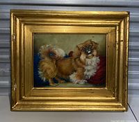 Frontal view of the entire framed painting showing the Pekingese dog on canvas and the surrounding gold frame.