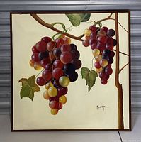 Full view of the vintage painting showing two clusters of grapes on a vine branch with leaves in realistic detail, with a cream background and brown frame.