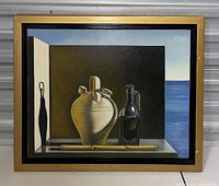 Front view of the signed vintage still life oil painting on canvas in a gold-colored frame showing the ceramic jug, glass bottle, and sea background.
