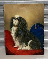 Full view of vintage canvas painting showing a small dog sitting on red cushion, blue pillow in background, warm background tones.