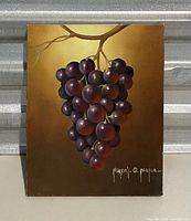 Full frontal image of painting showing a bunch of grapes on a vine with visible artist signature at bottom right.