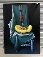 Full view of the painting showing the entire artwork on canvas depicting the chair, cloth, tassel, and melon slice against black background.