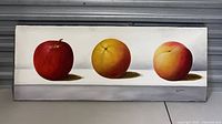 Full view of the vintage painting showing three fruits (apple, orange, peach) on a light background with shadows, signed by the artist.